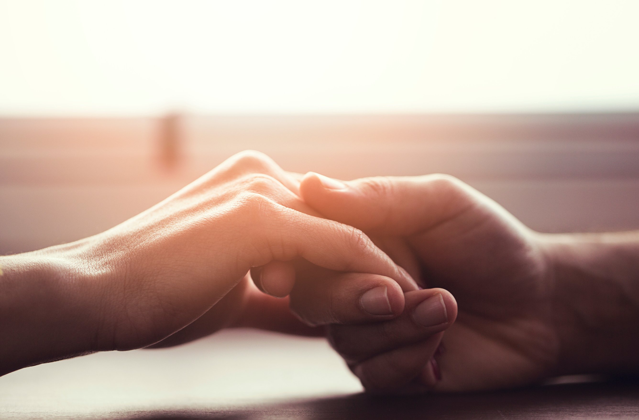 Couple holding hands